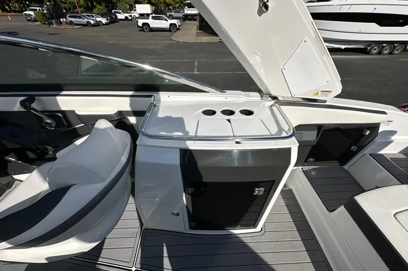 Slide: The Image of 2019 Monterey 278SS Super Sport boat interior with seating and American flag. - 17
