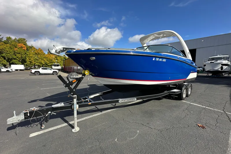 Slide: The Image of 2019 Monterey 278SS Super Sport boat on trailer in parking lot. - 2
