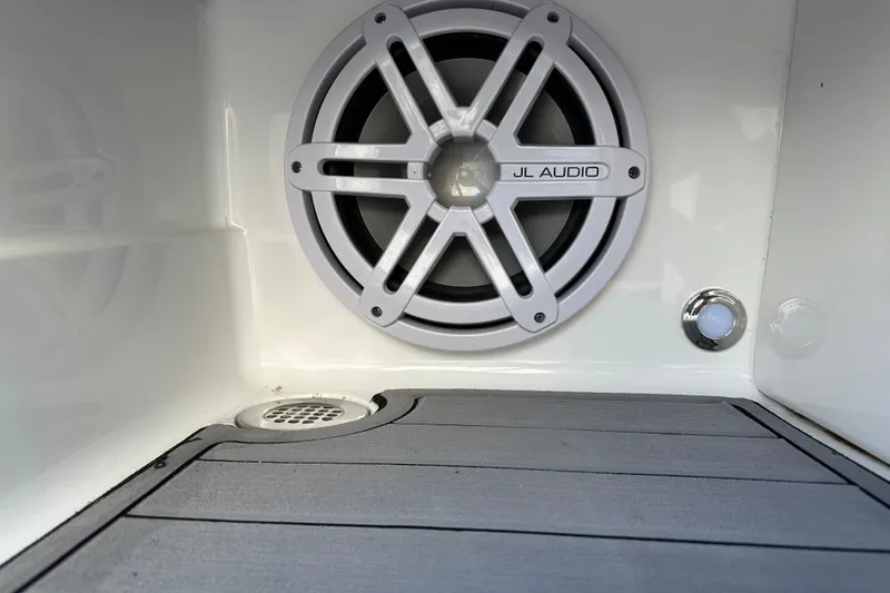 Slide: The Image of 2019 Monterey 278SS Super Sport boat engine compartment open at marina. - 24