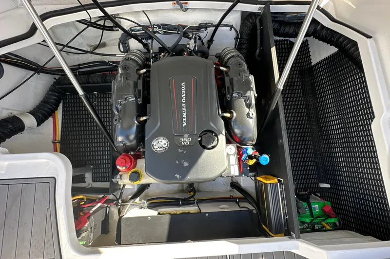 Slide: The Image of Engine compartment of a 2019 Monterey 278SS Super Sport boat, featuring detailed components. - 26