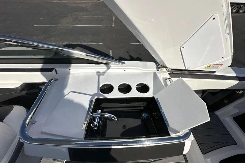 Slide: The Image of 2019 Monterey 278SS Super Sport boat interior with sleek cabinetry and modern flooring. - 32