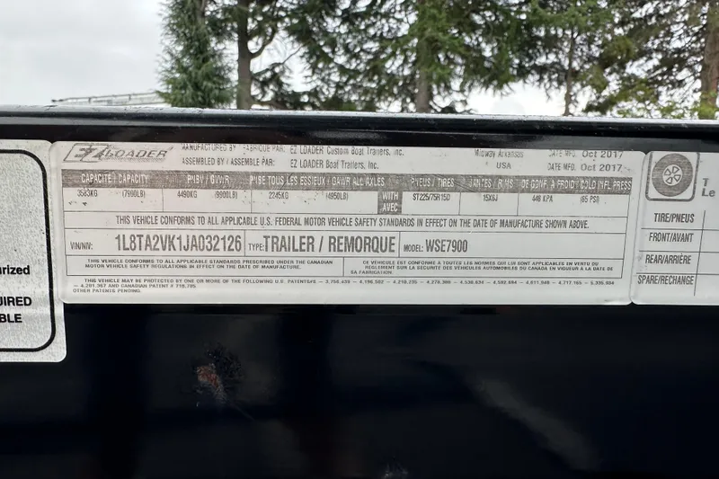 Slide: The Image of Label on EZ Loader trailer, showing specifications and compliance details. - 38