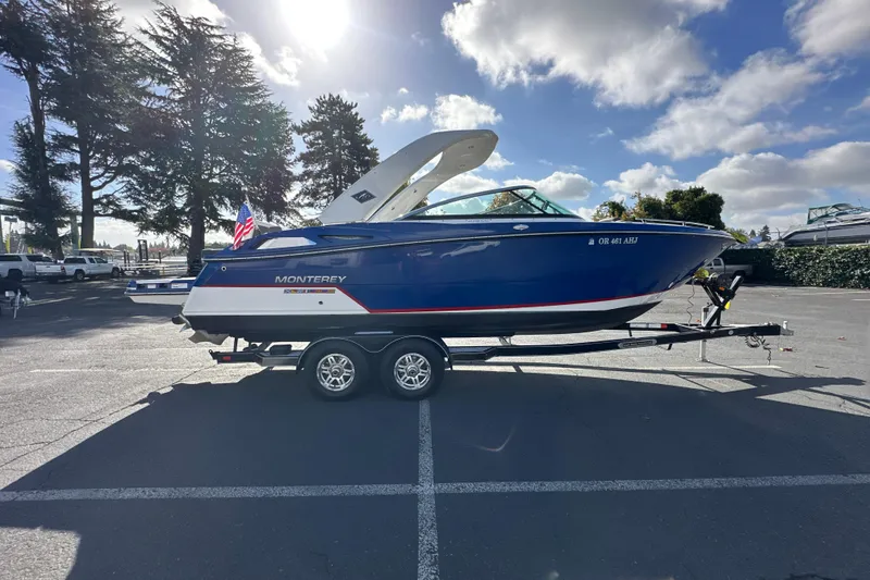 Slide: The Image of 2019 Monterey 278SS Super Sport boat on trailer under sunny sky. - 5