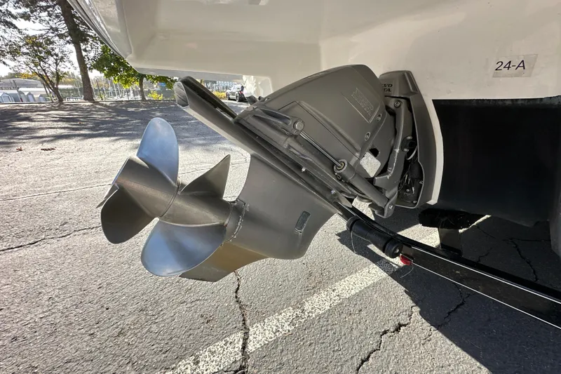 Slide: The Image of 2019 Monterey 278SS Super Sport boat rear view with swim platform and American flag. - 8