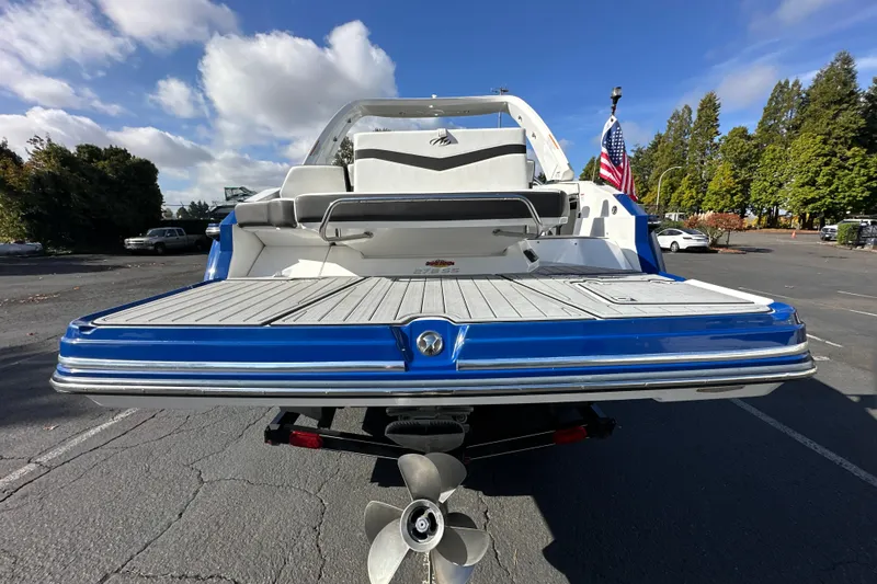 Slide: The Image of 2019 Monterey 278SS Super Sport boat with black cover in a marina parking lot. - 9