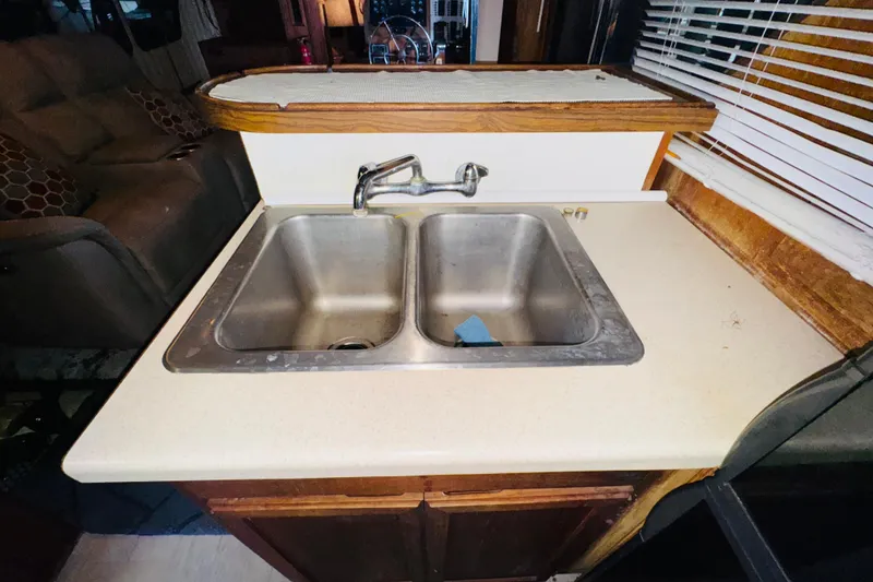 Slide: The Image of Double sink in 1985 Bluewater 51 Coastal Cruiser kitchen area. - 35