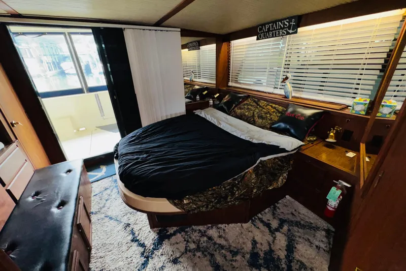 Slide: The Image of Luxurious bedroom in 1985 Bluewater 51 Coastal Cruiser yacht with elegant decor. - 38