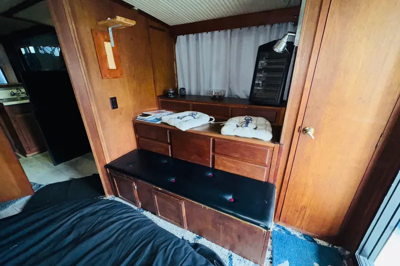 Slide: The Image of Interior of 1985 Bluewater 51 Coastal Cruiser with wooden cabinetry and seating. - 40
