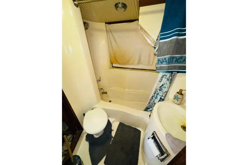 Slide: The Image of Bathroom interior of 1985 Bluewater 51 Coastal Cruiser with shower and nautical decor. - 42
