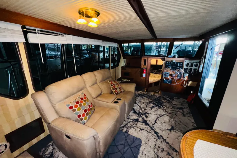 Slide: The Image of Interior of 1985 Bluewater 51 Coastal Cruiser with cozy seating and helm station. - 43