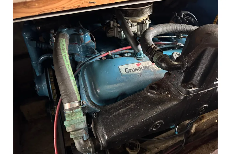 Slide: The Image of Engine of 1985 Bluewater 51 Coastal Cruiser with Crusader branding. - 48