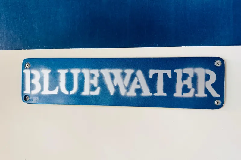 Slide: The Image of Bluewater 51 Coastal Cruiser 1985 nameplate on a blue and white background. - 49