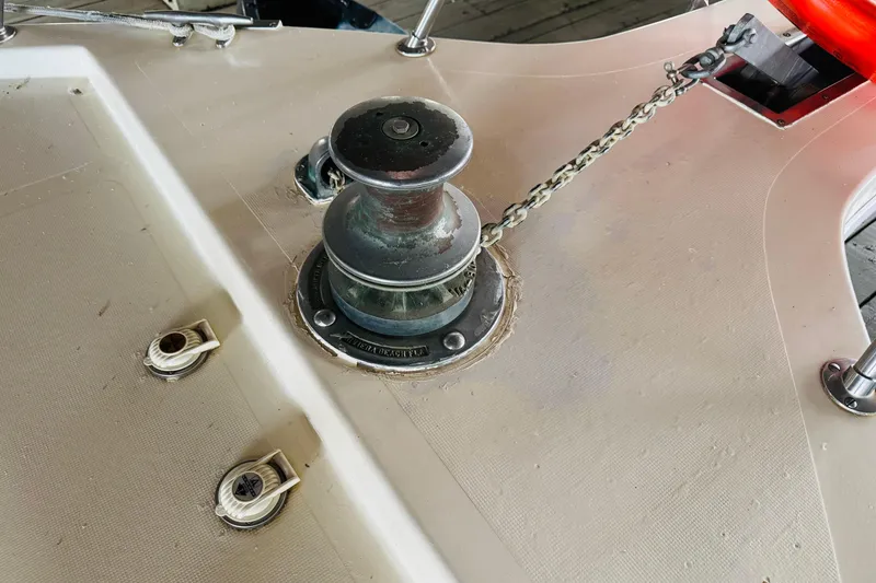 Slide: The Image of Anchor winch on 1985 Bluewater 51 Coastal Cruiser boat deck. - 6