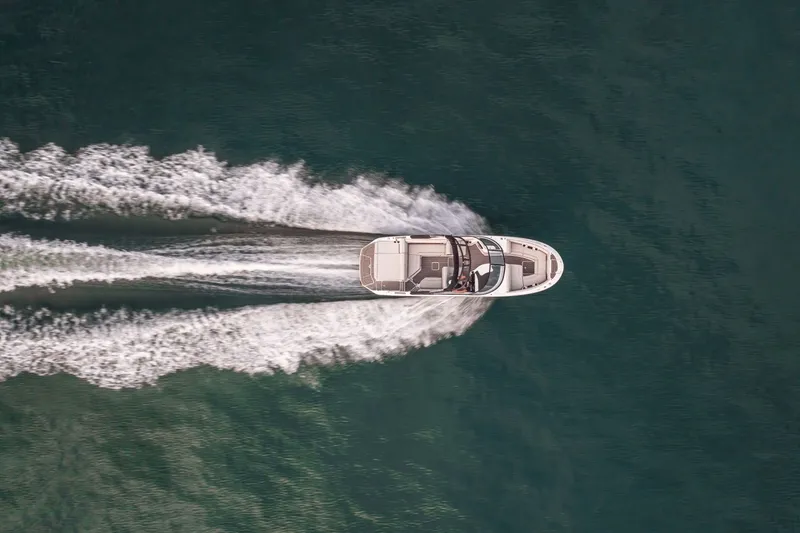 Slide: The Image of Aerial view of a 2026 Sea Ray SDX 250 boat on water. - 21