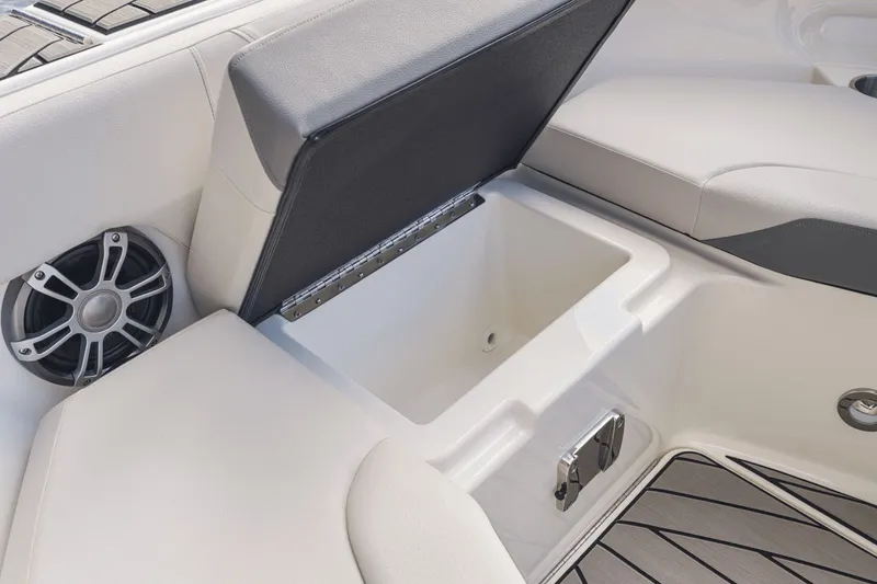 Slide: The Image of 2026 Sea Ray SDX 250 seating with integrated storage compartment. - 22