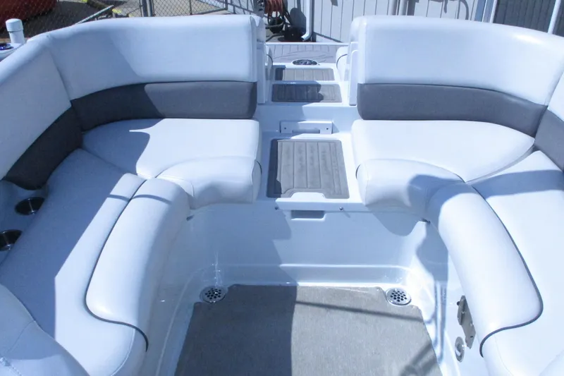 Slide: The Image of 2017 Crownline 255 SS boat interior with white cushioned seating. - 7