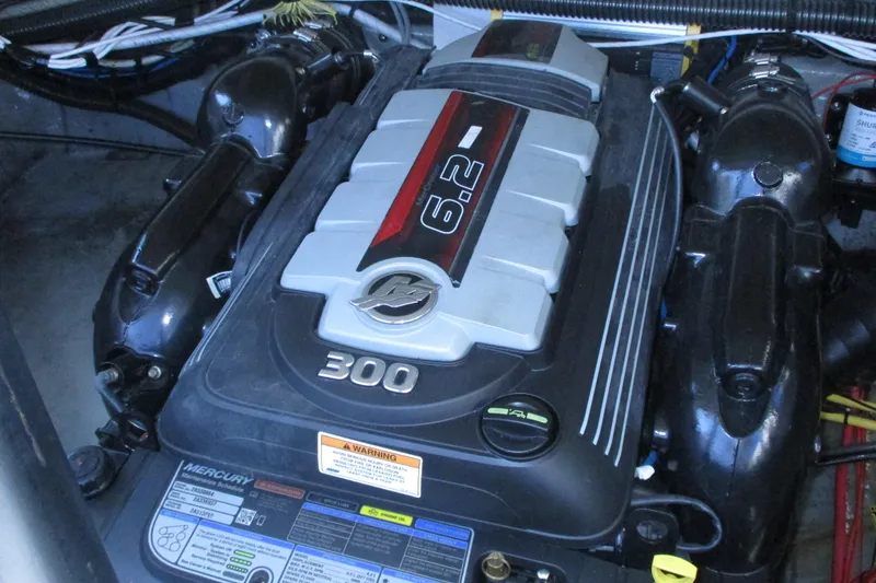 Slide: The Image of 2017 Crownline 255 SS boat interior with sink and portable toilet. - 9