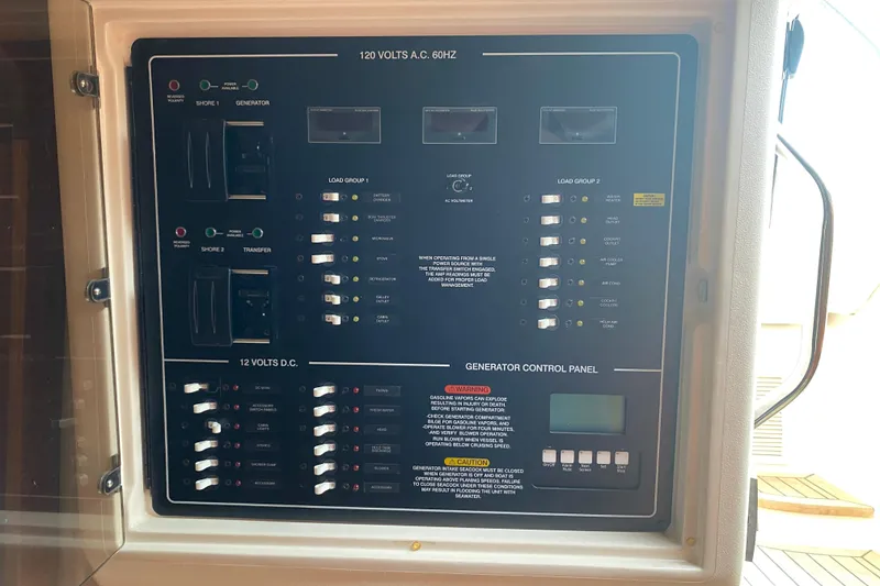 Slide: The Image of Electrical control panel on a 2012 Grady-White Express 360 boat. - 14