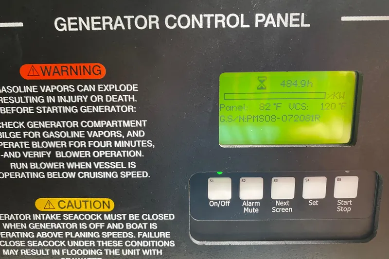 Slide: The Image of Generator control panel with safety warnings on a 2012 Grady-White Express 360 boat. - 15