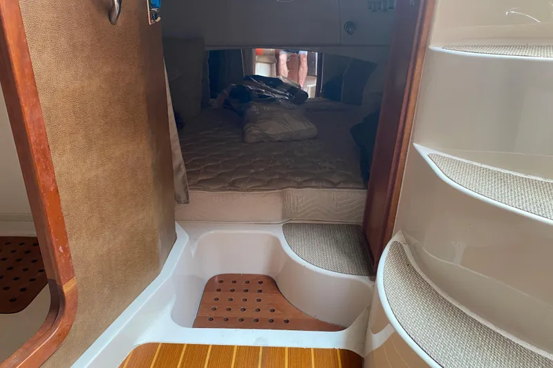 Slide: The Image of Interior cabin of 2012 Grady-White Express 360 boat with cozy bedding. - 20