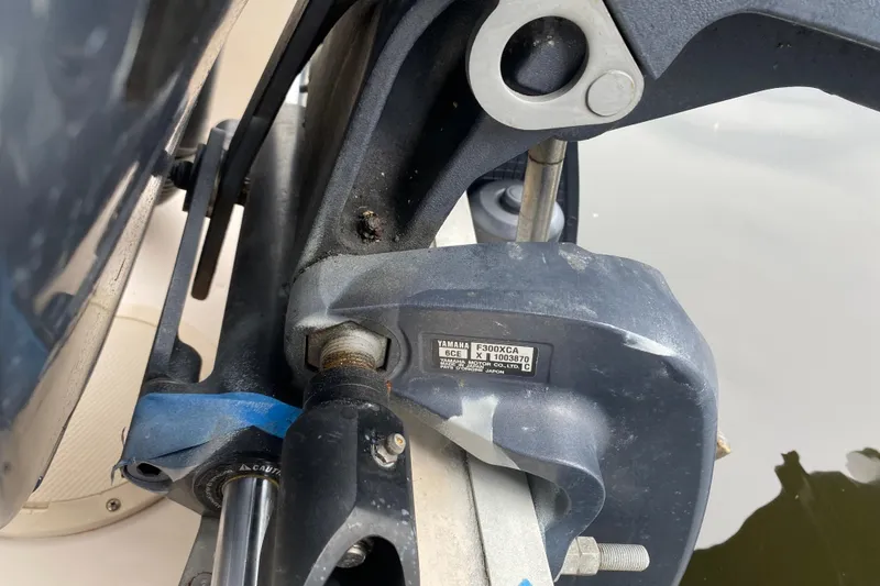 Slide: The Image of Close-up of a Yamaha F300XCA engine part on a 2012 Grady-White Express 360 boat. - 28