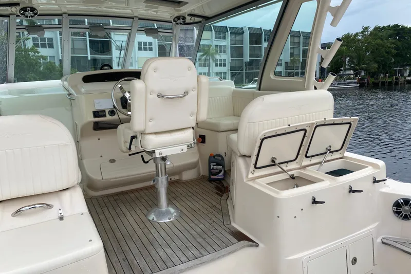 Slide: The Image of 2012 Grady-White Express 360 boat interior with helm and seating area. - 5