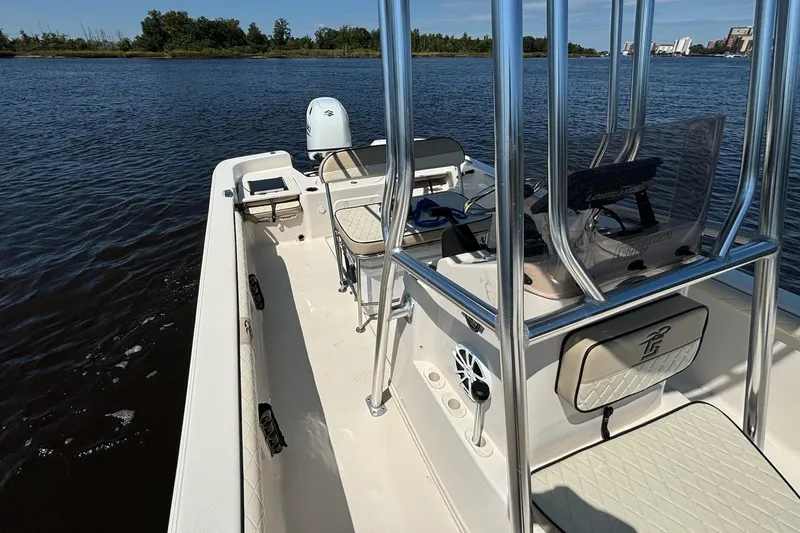 Slide: The Image of 2023 Carolina Skiff 21 LS boat on water, featuring sleek design and modern amenities. - 10