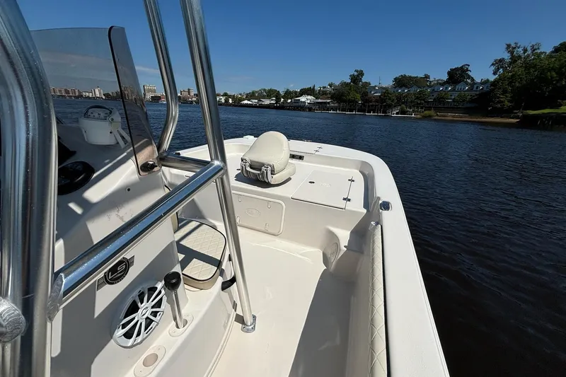 Slide: The Image of 2023 Carolina Skiff 21 LS boat on calm water, showcasing interior and console. - 20