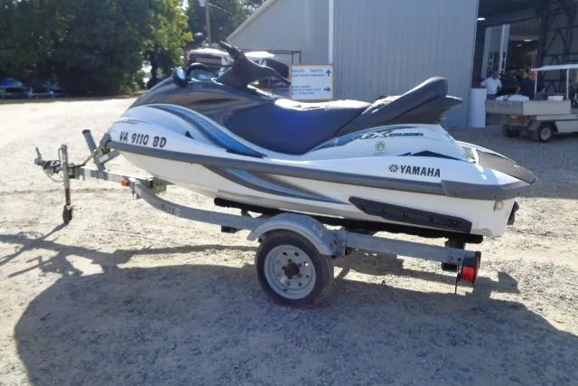 Slide: The Image of 2004 Yamaha WaveRunner FX Cruiser on trailer, parked outdoors near a building. - 4