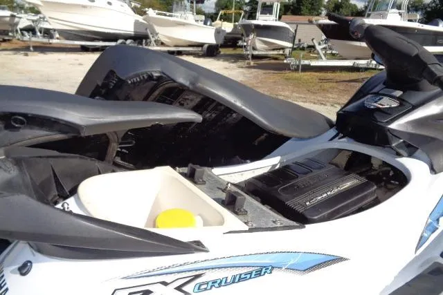 Slide: The Image of 2004 Yamaha WaveRunner FX Cruiser with open engine compartment, parked among other boats. - 8