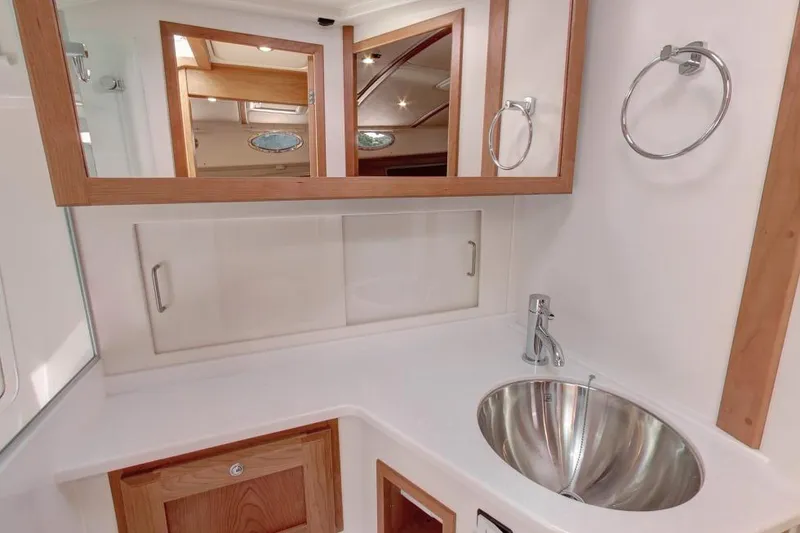 Slide: The Image of Luxurious bathroom in 2026 Back Cove 372 yacht with modern sink and wooden accents. - 4