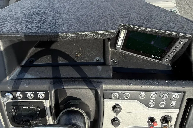 Slide: The Image of Dashboard of 2026 Berkshire 23CL STS boat with Lowrance Elite display and controls. - 11