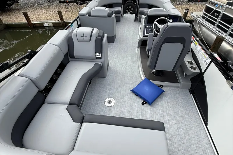 Slide: The Image of 2026 Berkshire 23CL STS pontoon boat, saltwater edition, with sleek black and white design. - 4