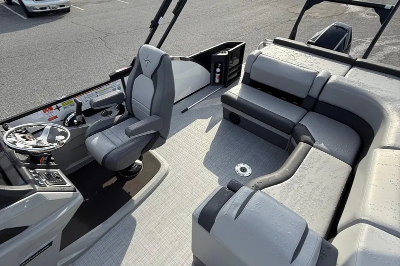 Slide: The Image of 2026 Berkshire 23CL STS boat interior with modern seating and steering console. - 8