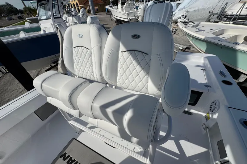 Slide: The Image of 2026 Sportsman Masters 227 Bay Boat with luxurious white seating and modern design. - 11