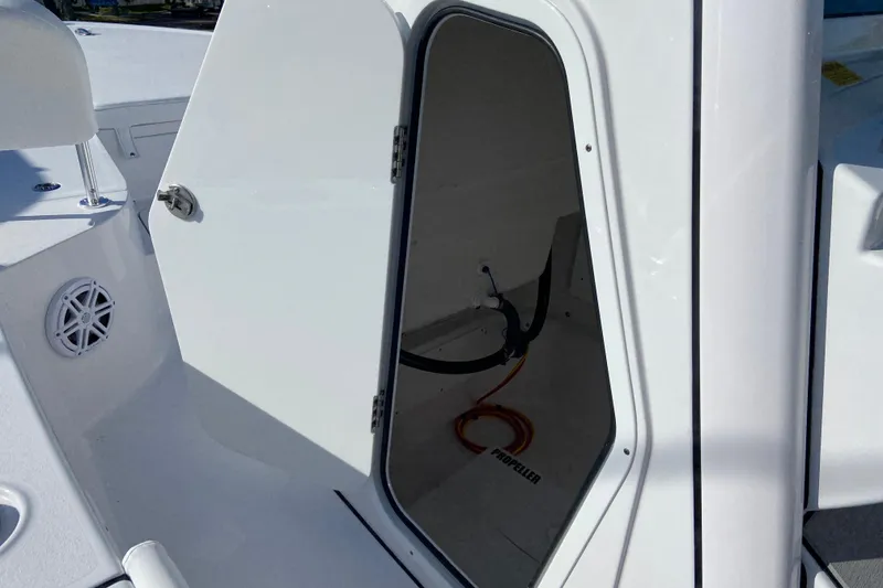 Slide: The Image of Open storage compartment on 2026 Sportsman Masters 227 Bay Boat, showcasing interior space. - 24