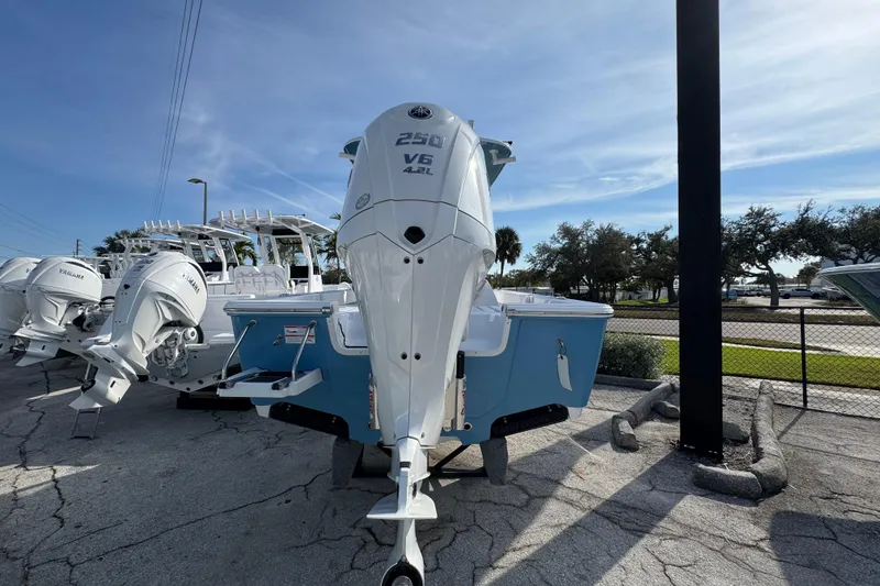 Slide: The Image of 2026 Sportsman Masters 227 Bay Boat with Yamaha V6 engine, displayed outdoors. - 4