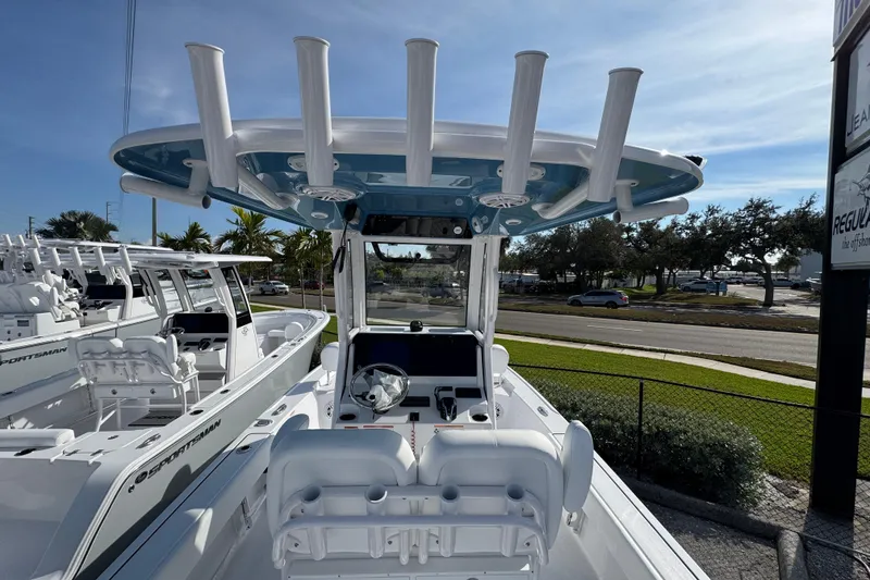 Slide: The Image of 2026 Sportsman Masters 227 Bay Boat with T-top and dual seating, parked outdoors. - 7