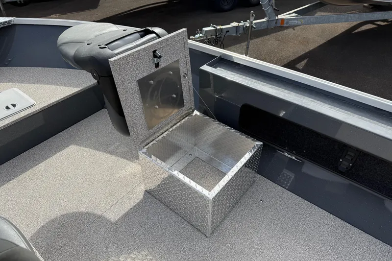 Slide: The Image of 2026 Fish Rite Angler 18 boat interior with open storage compartment and seating. - 10