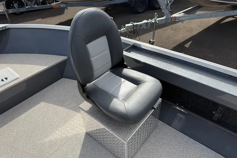 Slide: The Image of 2026 Fish Rite Angler 18 boat seat, gray and black, on diamond plate base. - 13