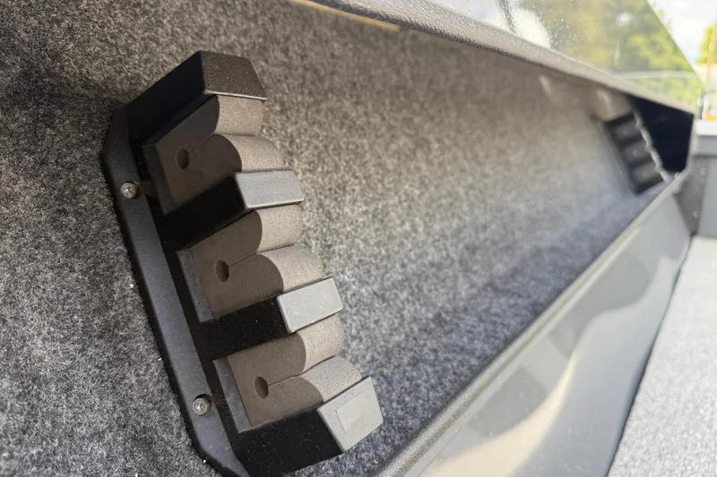 Slide: The Image of Interior view of 2026 Fish Rite Angler 18 boat with rod holders and carpeted finish. - 14