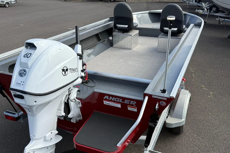 Slide: The Image of 2026 Fish Rite Angler 18 boat with Tohatsu 60 engine, featuring dual seats and spacious deck. - 18