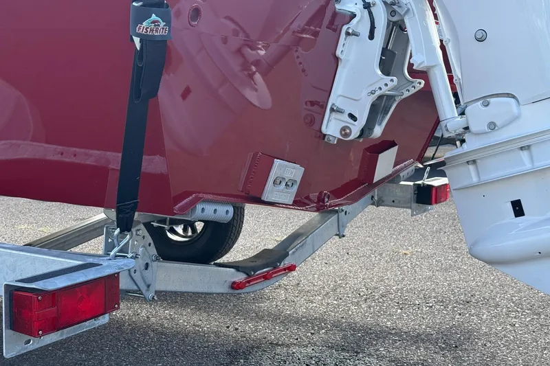 Slide: The Image of 2026 Fish Rite Angler 18 boat on trailer, showing rear view and motor mount. - 19