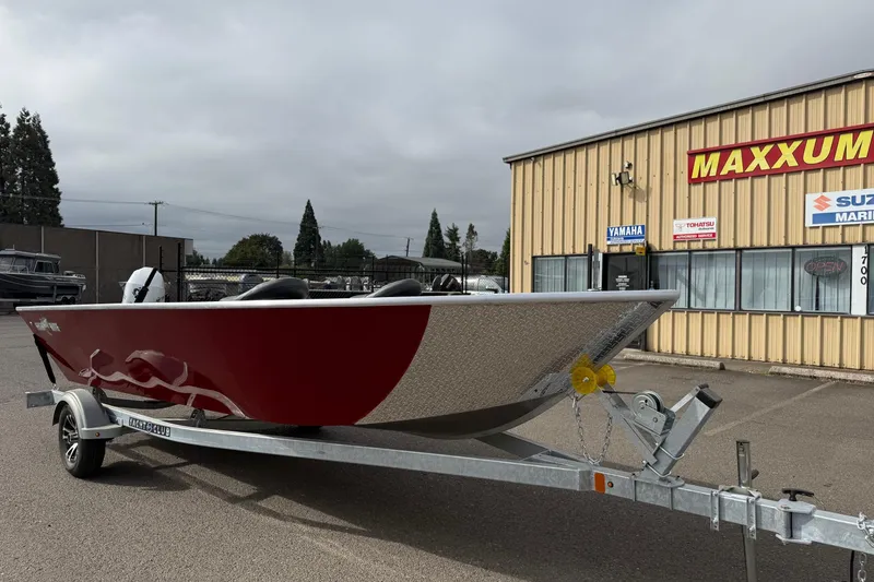 Slide: The Image of 2026 Fish Rite Angler 18 boat on trailer outside Maxxum Marine dealership. - 2
