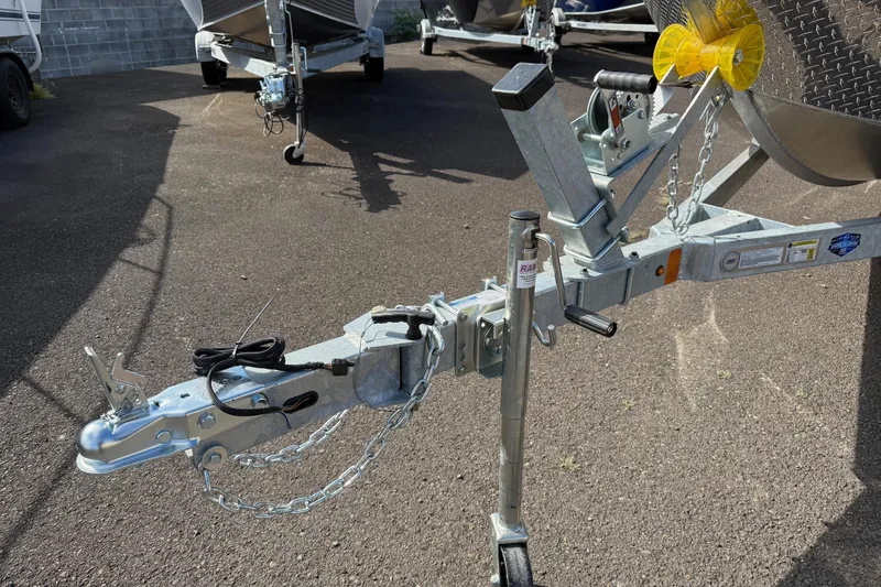 Slide: The Image of Trailer hitch of 2026 Fish Rite Angler 18 boat on asphalt surface. - 21