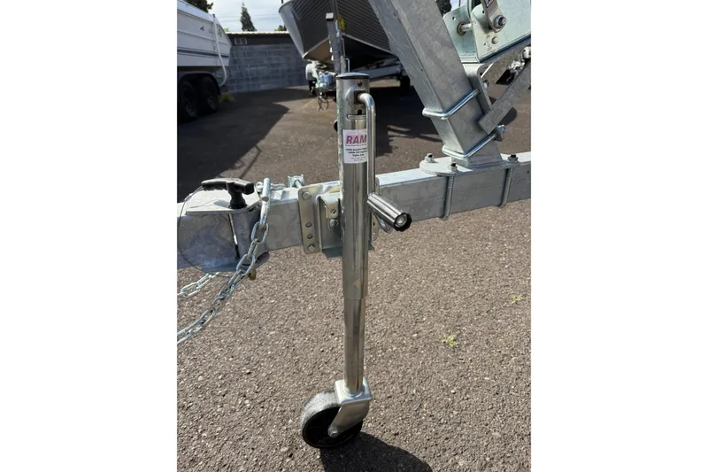 Slide: The Image of Trailer jack on a 2026 Fish Rite Angler 18 boat trailer. - 23