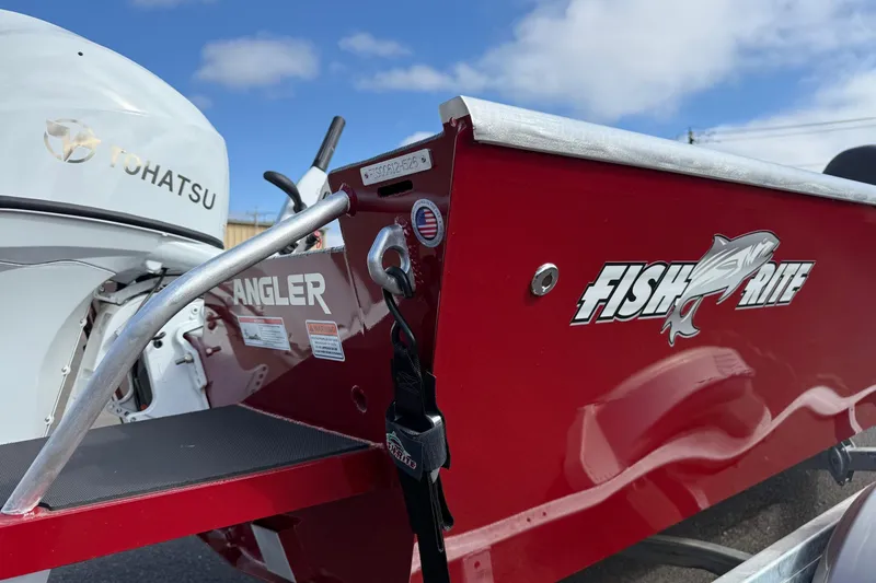 Slide: The Image of Red Fish Rite Angler 18 boat, 2026 model, with Tohatsu engine, under blue sky. - 27