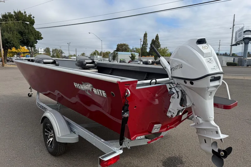 Slide: The Image of 2026 Fish Rite Angler 18 boat with Tohatsu outboard motor on a trailer. - 3