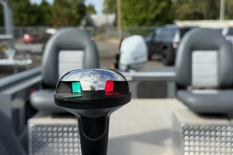 Slide: The Image of 2026 Fish Rite Angler 18 boat interior with navigation light and seating. - 4