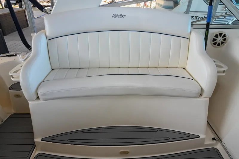Slide: The Image of 2000 Rinker Fiesta Vee 330 boat seating with white upholstery. - 13